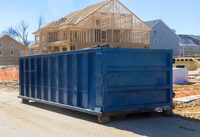 dumpsters for rent outside a residential building